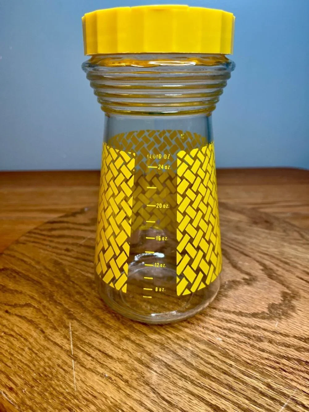 Vintage Folger's glass carafe with lid. Bright yellow basket weave design. Measu